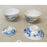 A 19th Century eggshell blue and white lidded teabowl decorated flowers and another teabowl (