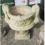 A pair concrete garden urns twin handles and a painted black garden urn