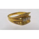 An 18ct gold ring with four small diamonds 5g, size P