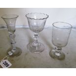 Eight tall old drinking glasses