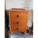 A pine unit and bedside chest