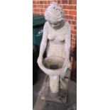 A concrete garden model of lady holding bowl on a stand