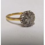 An 18ct gold diamond cluster ring 2.8g
