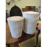 Two white wicker lidded linen baskets