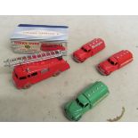 A boxed Dinky fire engine and three Dinky Petrol Carriers