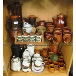 A Totem pottery coffee set, Holkam pottery coffee set and other brown pottery