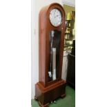 An Art Deco walnut grandfather clock, cream dial J. Vella, Malta, striking movement, three weight