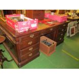 A 20th Century partner's desk panelled ends and drawers to each side
