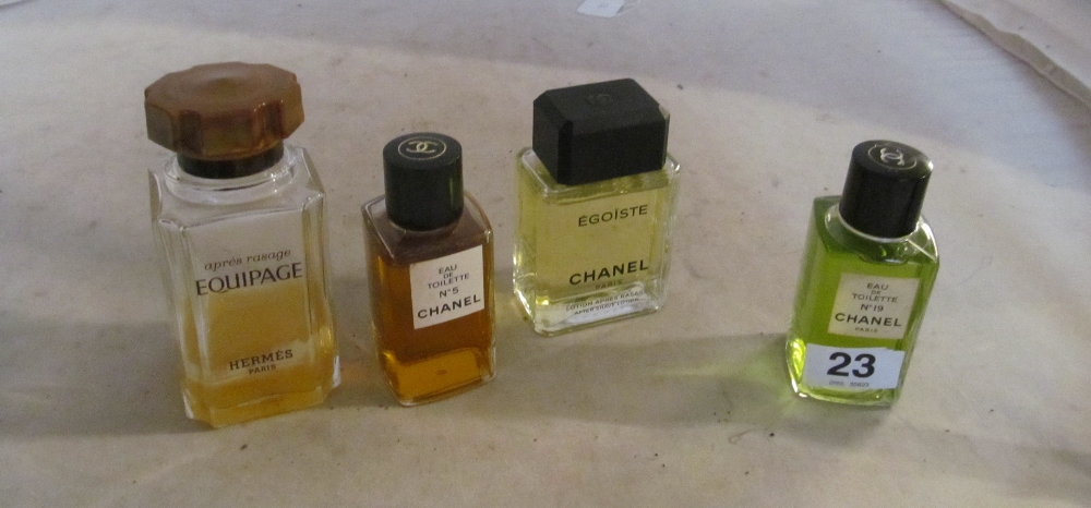 A bottle of Chanel No.5 Eau de Toilette, Chanel No.19 Eau de Toilette and two dummy display bottles