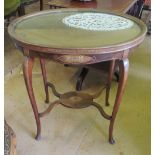 An Edwardian oval tray top table on cabriole legs