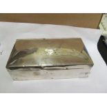 A silver cigarette box and silver plated three-piece condiment