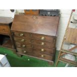 A George III mahogany bureau four drawers on bracket feet (water damage)