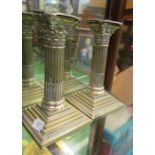 A pair of silver-plated Corinthian column candlesticks