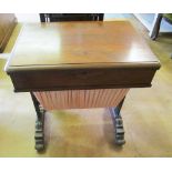 A William IV rosewood sewing table with slide basket ( water damage)