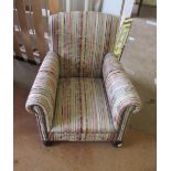 A child's armchair on turned feet