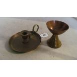 A copper and brass goblet and chamberstick