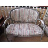 A French style grey painted salon settee and two oval backed chairs on fluted supports