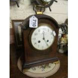 An Edwardian mahogany and satinwood string bracket clock