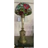 A classical design brass table lamp with Tiffany style shade