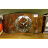 An Art Deco walnut mantel clock striking movement