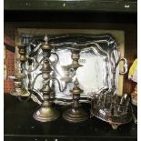 A plated two handled tray (boxed), another tray, plated candelabra and a plated condiment stand with