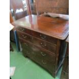 A 19th Century mahogany chest of two short and three long drawers (water damage)