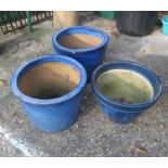 A pair of blue glazed garden pots and another similar