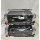 A Burago 1/18 Mercedes F1W07 Hybrid Nico Rosberg and another Lewis Hamilton