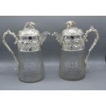A Pair of Cut Glass and Silver Plated Claret Jugs embossed with Grapevine and with figural head