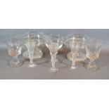 A Pair of Edwardian Glass Comports together with a set of three 19th Century engraved cordial
