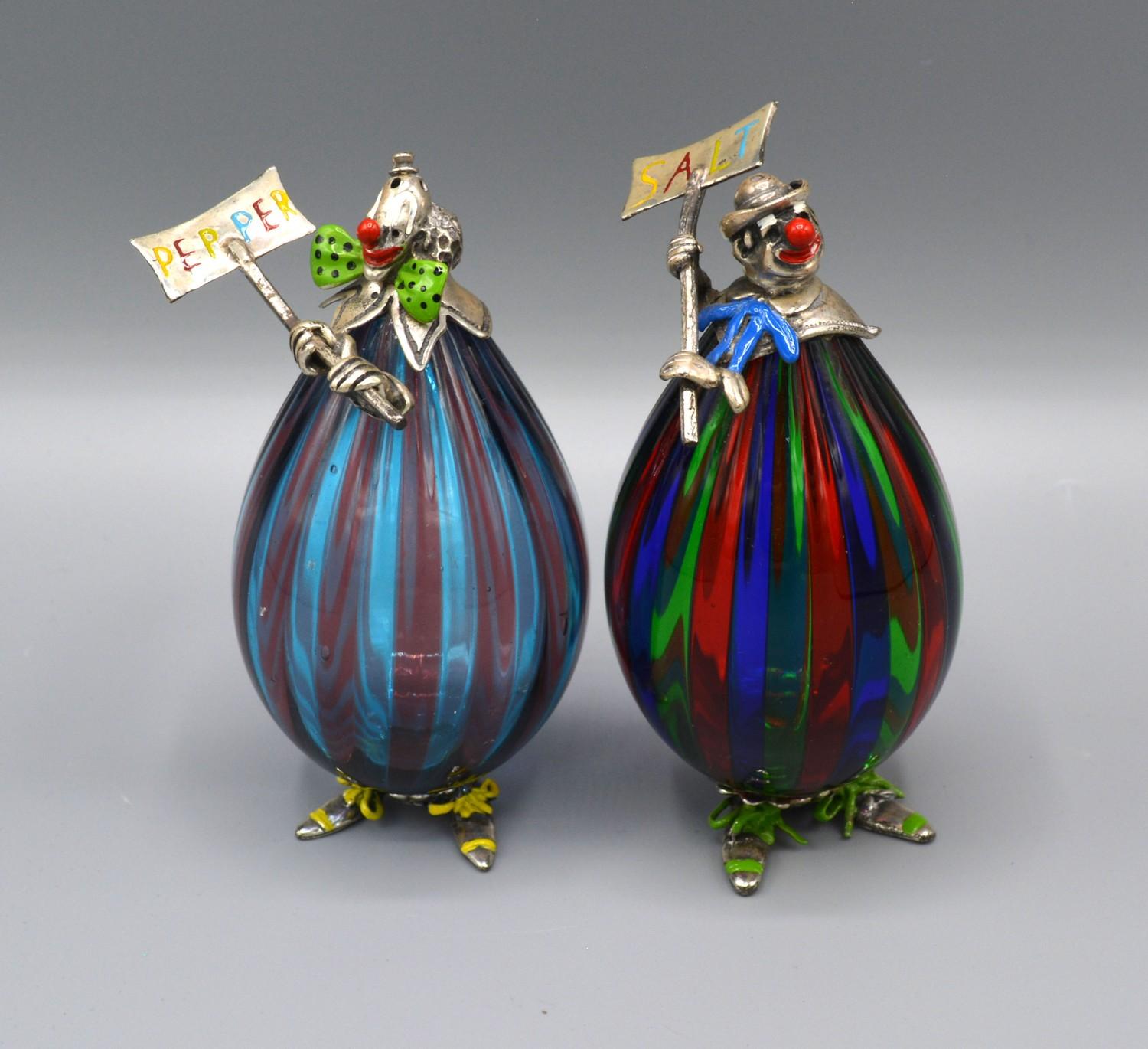 A Pair of Silver Mounted Morano Glass Clowns 'Salt and Pepper' with enamel decorated silver heads