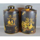 A Pair of Tollware Covered Canisters with chinoiserie decoration upon a black ground and highlighted