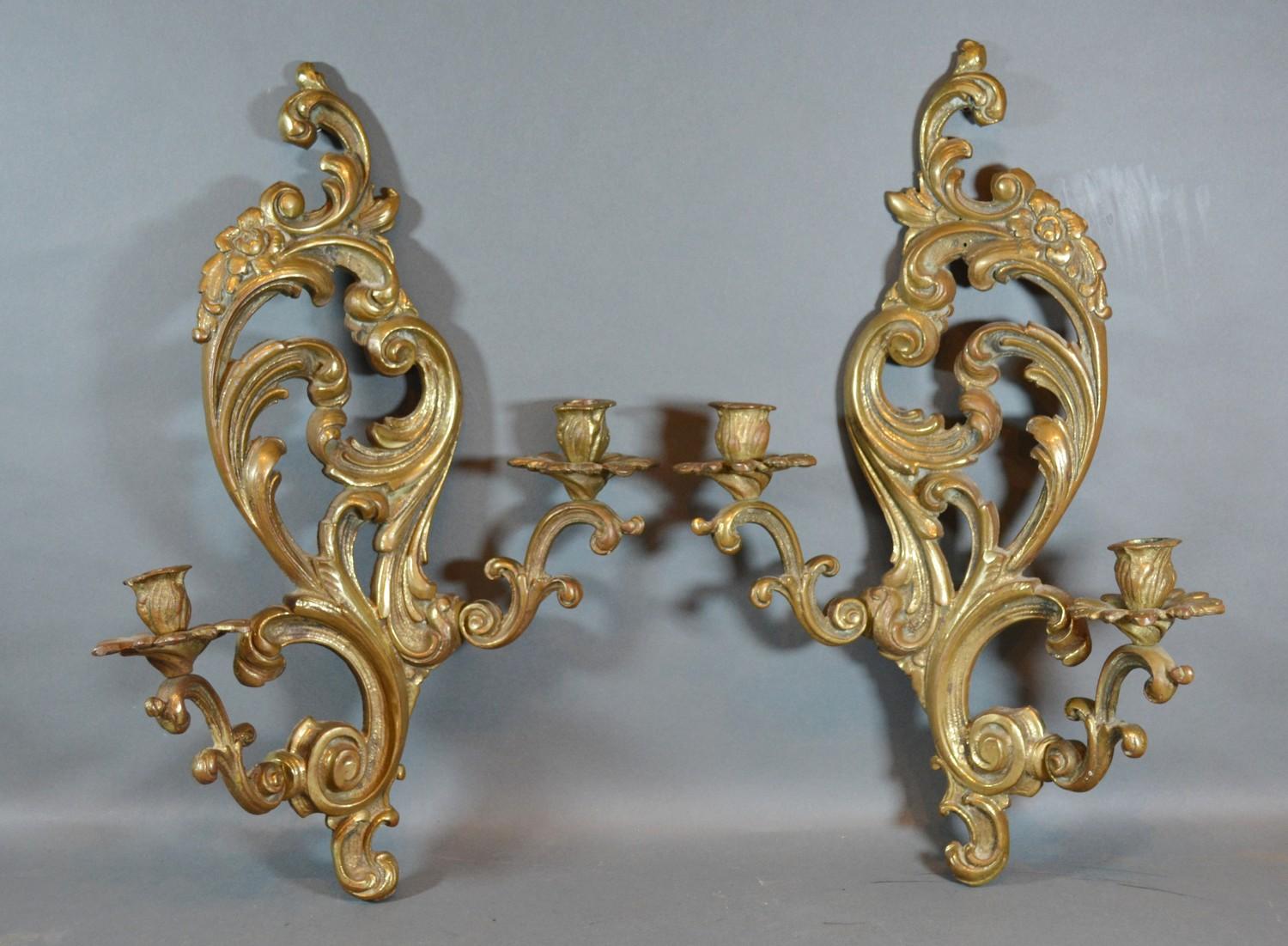 A Pair of French Patinated Bronze Wall Sconces of shaped scroll form 49cm long