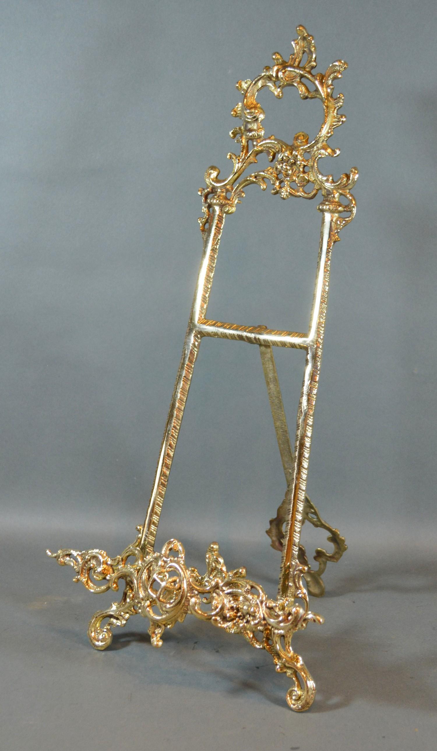 A French Style Brass Picture Easel of pierced scroll form 50cm tall