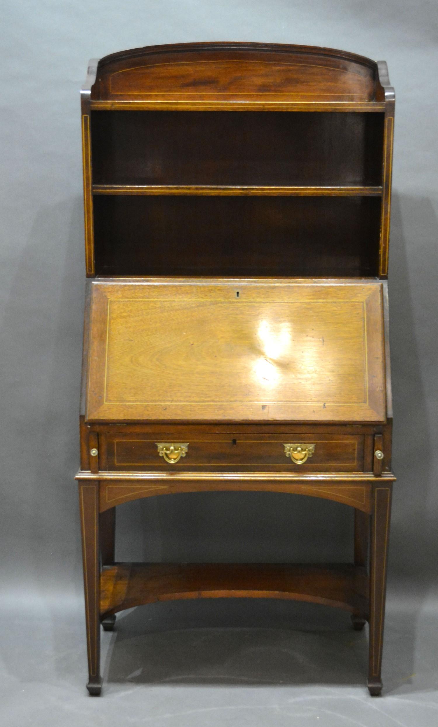 An Edwardian Mahogany Line Inlaid Bureau Bookcase with open shelves and a fall front enclosing a