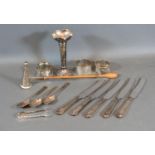 A London Silver Candle Snuffer with turned wooden handle together with three silver napkin rings,