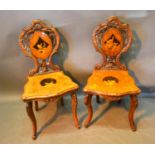 A Pair of 19th Century Black Forest Side Chairs each with a shaped pierced back with an inlaid