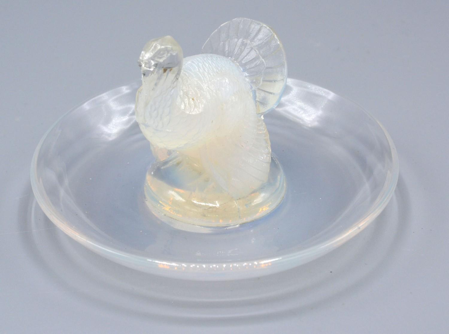 A Lalique Opalescent Glass Pin Tray signed R Lalique France No. 287, 10 cms diameter