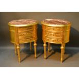 A Pair of Oval Gilded Three Drawer Chests each with a rouge marble top above three drawers raised