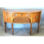A Regency Mahogany Demi-Lune Sideboard, the line inlaid top above a central drawer and tambour