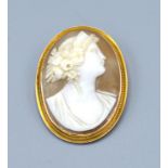 An Oval Cameo Brooch decorated in relief with a Classical Bust within 9ct. gold frame, 4 x 3 cms