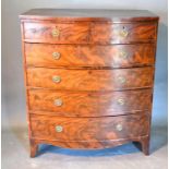 A 19th Century Mahogany Bow Fronted Chest of two short and four long drawers with oval brass handles