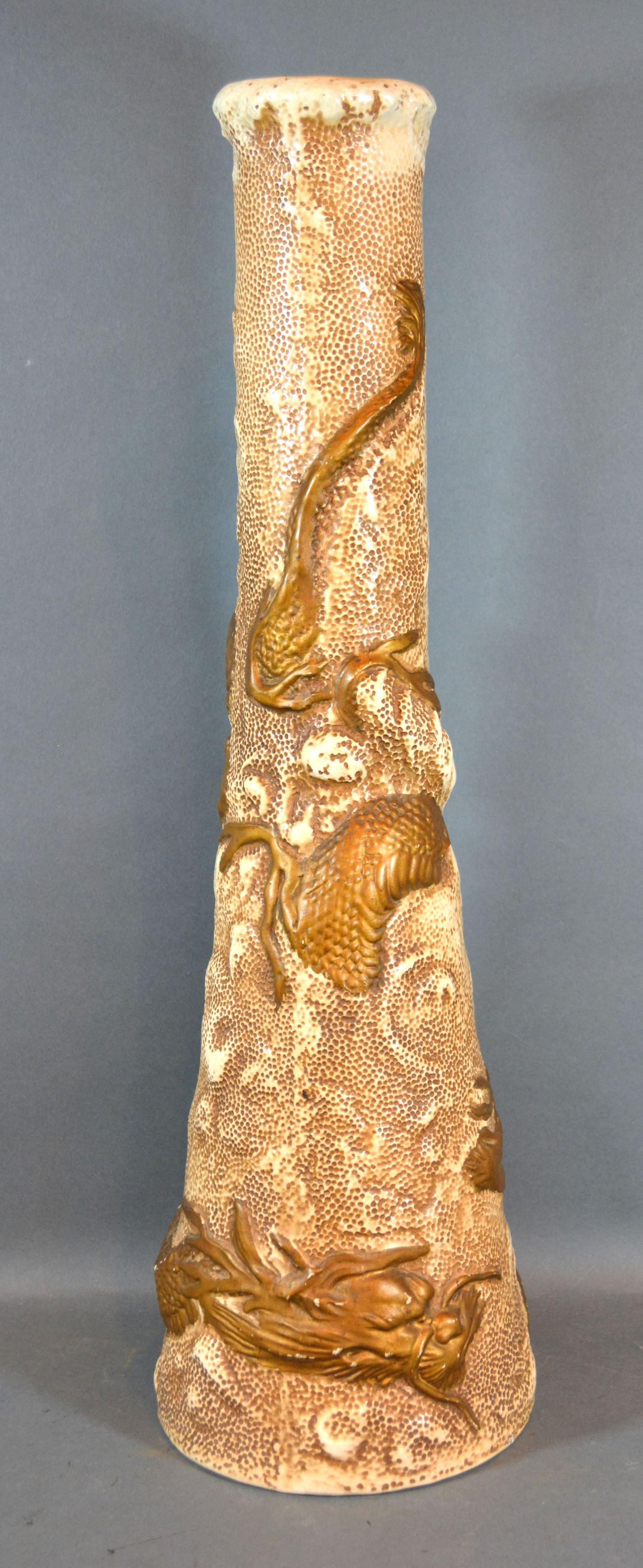 A Bretby Pottery Large Vase decorated in relief in the Japanese style with a serpent and of