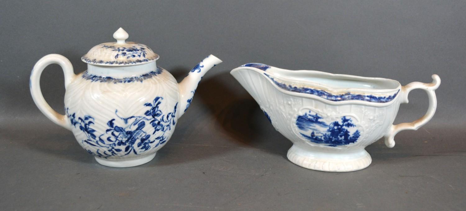 A First Period Worcester Sauce Jug decorated in underglaze blue with a reserve together with a