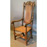 A 17th Century Style Armchair, the carved pierced and cane back above a cane seat with scroll arms