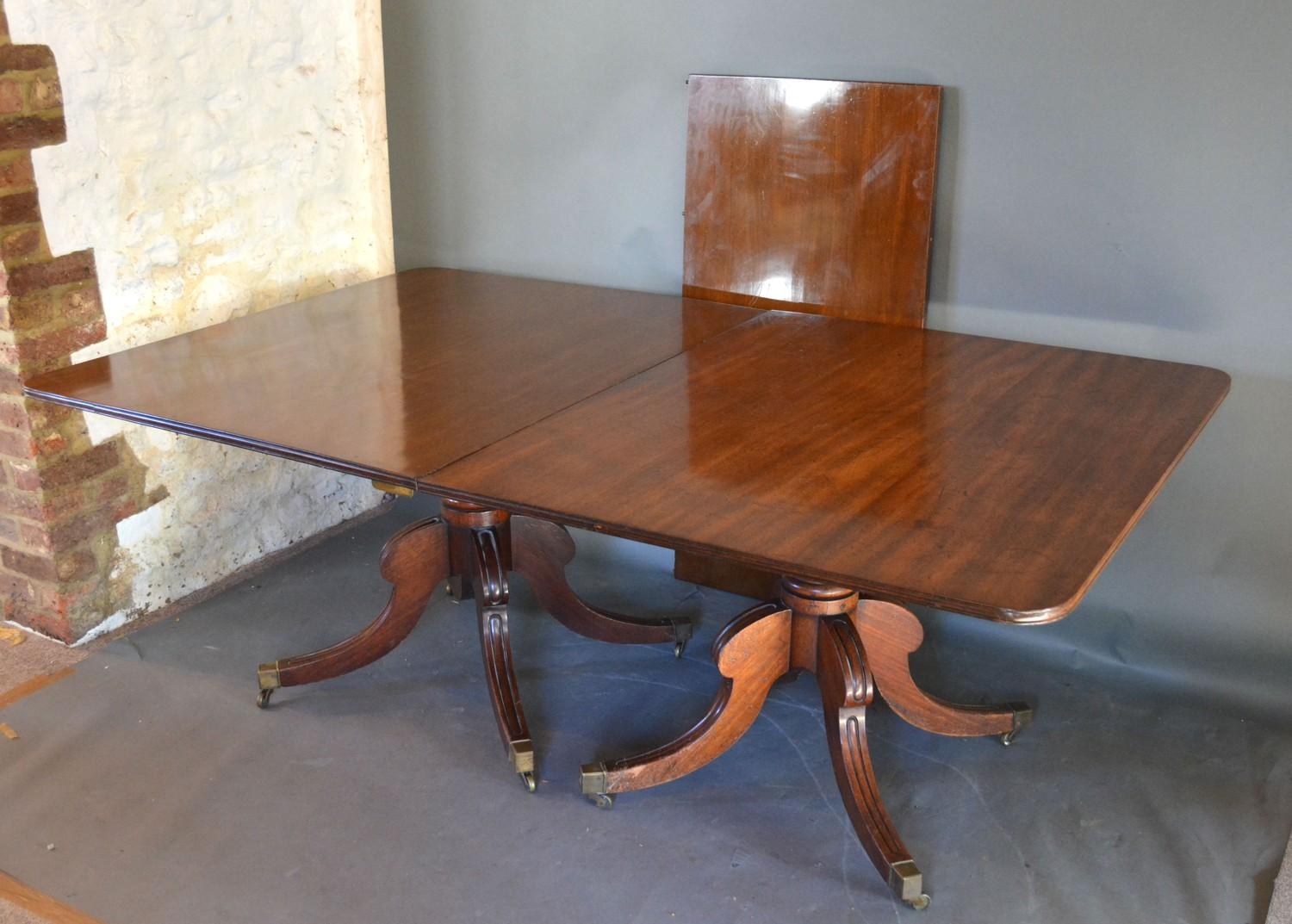 A Regency Mahogany Dining Table, the reeded top above twin end turned supports with reeded - Image 2 of 3