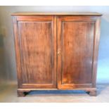 A 19th Century Mahogany Dwarf Hall Cupboard with two panelled doors raised upon bracket feet, 128
