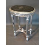 A French Style Silvered Side Table with variegated marble top above a carved frieze raised upon
