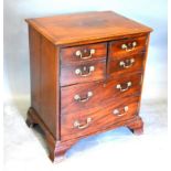 A 19th Century Mahogany Converted Commode, the moulded top above three doors simulated as drawers