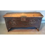 A 18th Century Oak Coffer, the hinged top above a plain front with iron escutcheon, 108 cms wide, 37